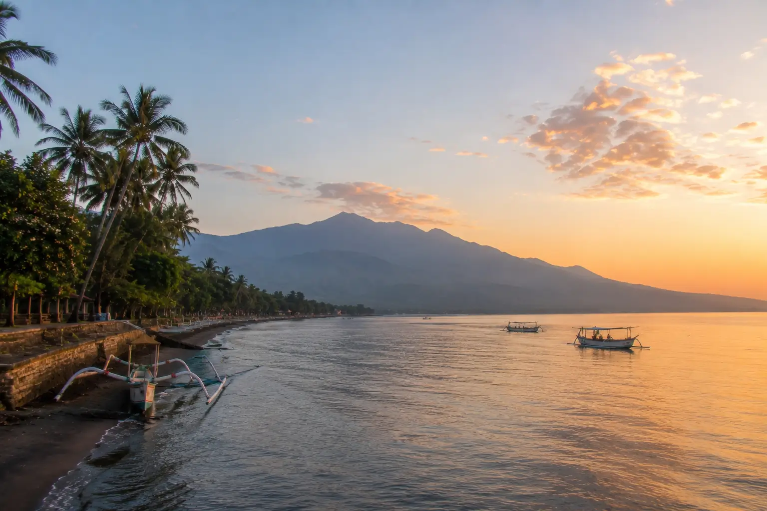 Sunrise view over the peaceful coastline of Lovina Bali with traditional fishing boats