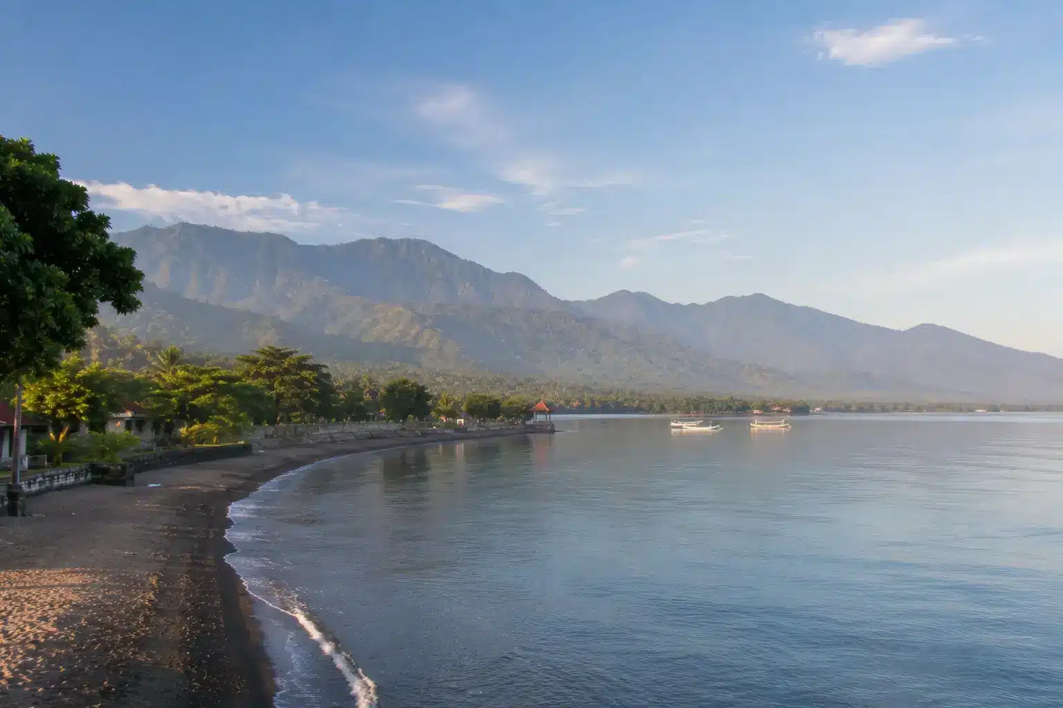 Calm coastline in Pemuteran Bali with mountain views and clear waters